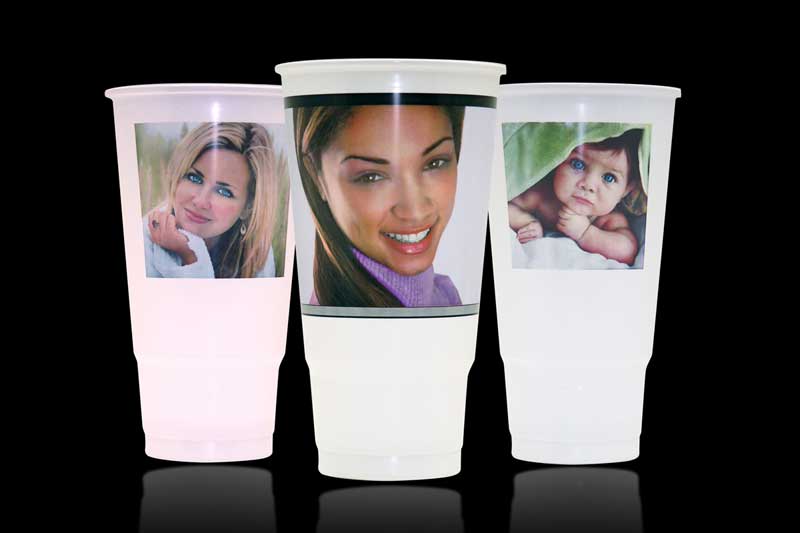 Three cups with photos of people.