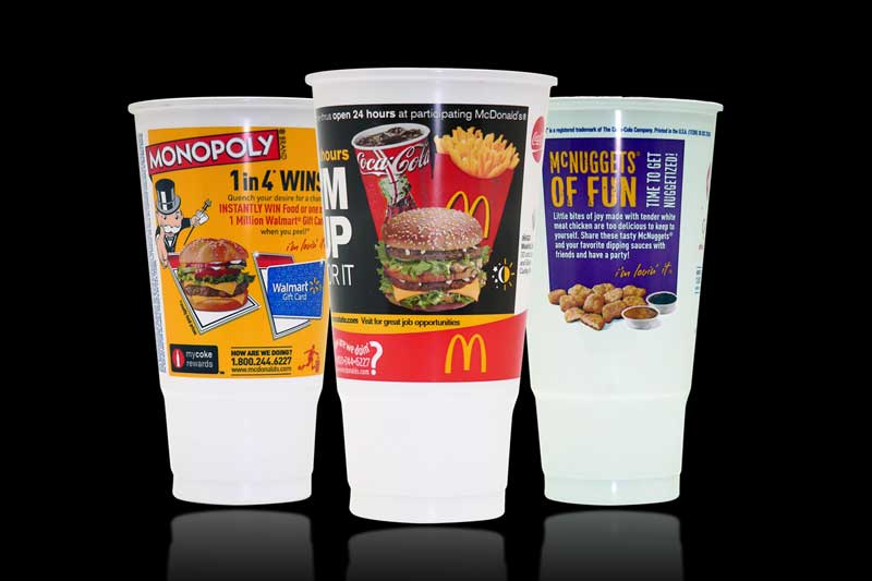 Three McDonald's promotional cups on display.