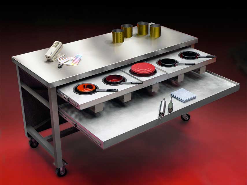 Industrial stainless steel table with tools.