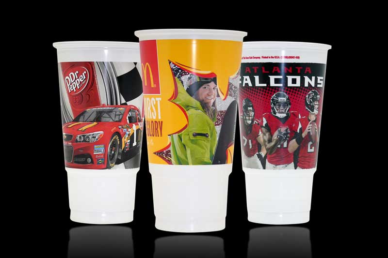Three branded plastic cups with sports designs.