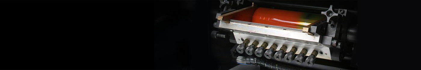 Printing machine with orange ink roller.