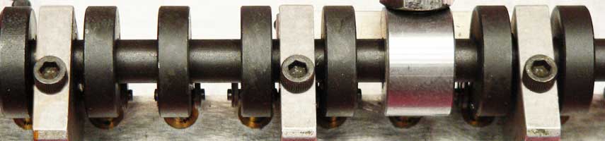 Close-up of a camshaft with bearings.
